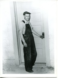Man Locking Exterior Door