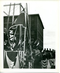 Soldiers Raising Army-Navy “E” production Award Flag